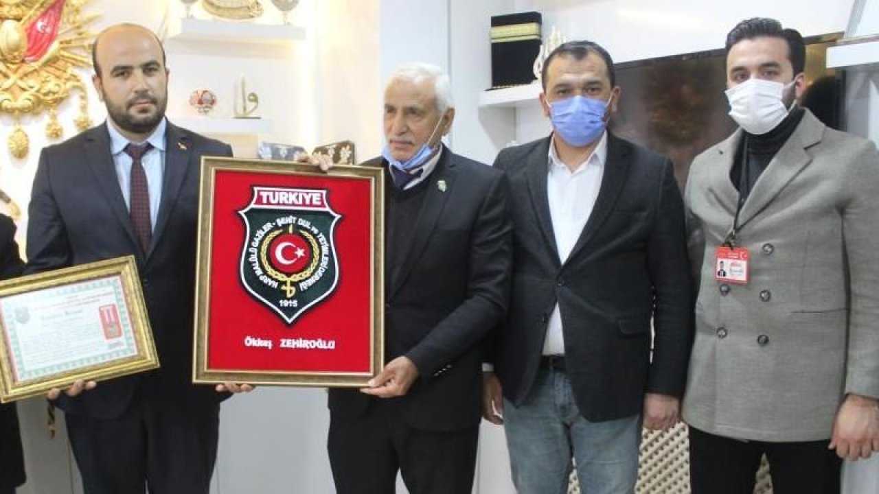 Şehitlikteki çalışmalara plaketli teşekkür